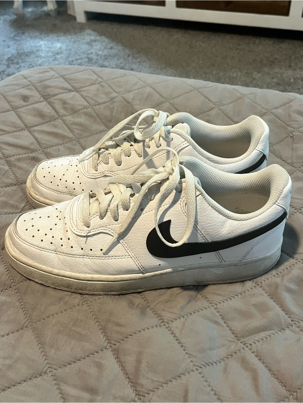 Nike White Low-Top Sneakers with Black Swoosh